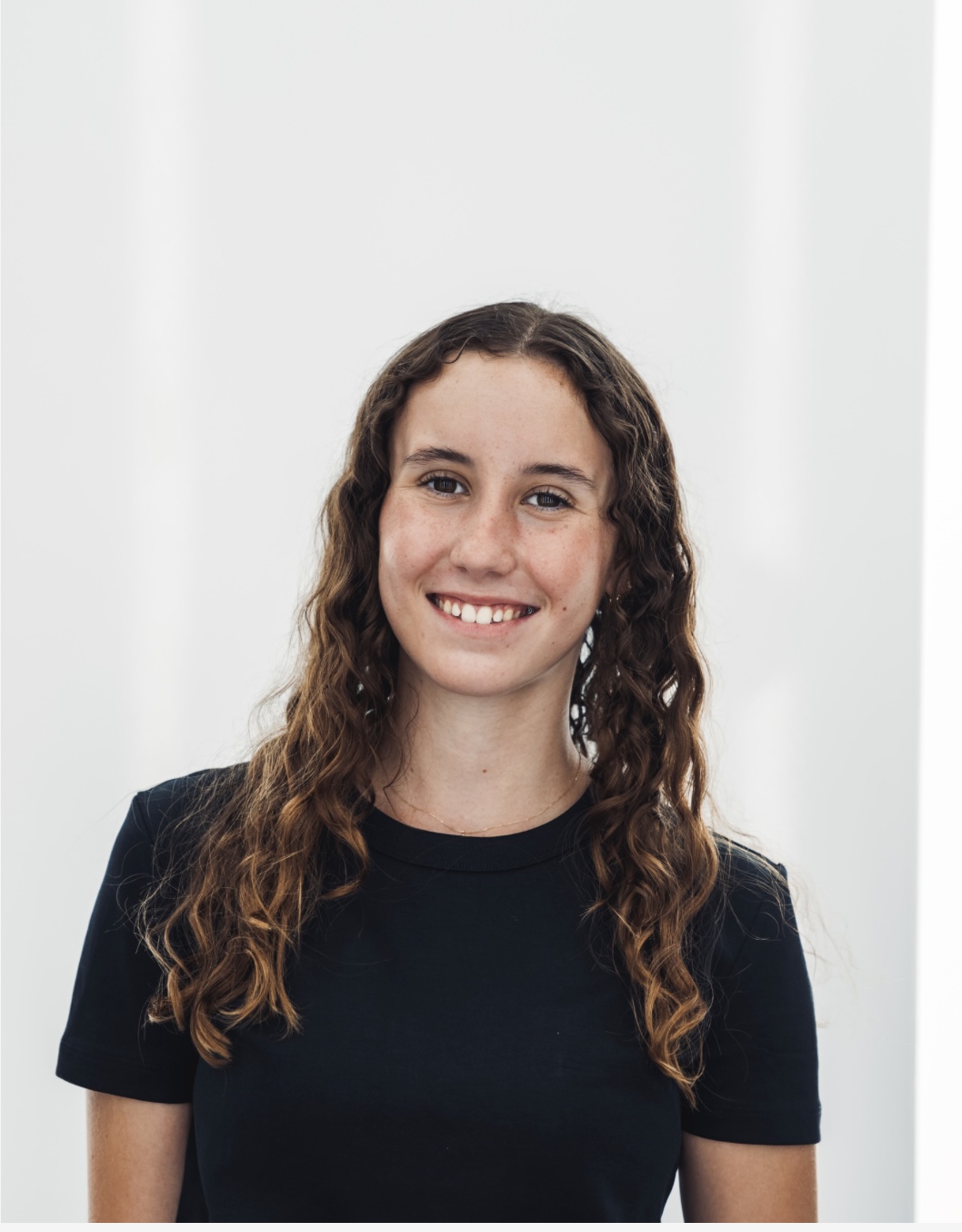 Professional headshot of the UT Austin Sport Management student, a smiling young woman.